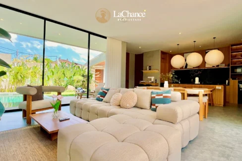 beautiful enclosed living room with high end material and swimming pool view